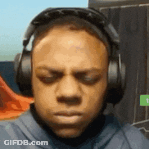 A Man Wearing Headphones Is Making A Funny Face . GIF
