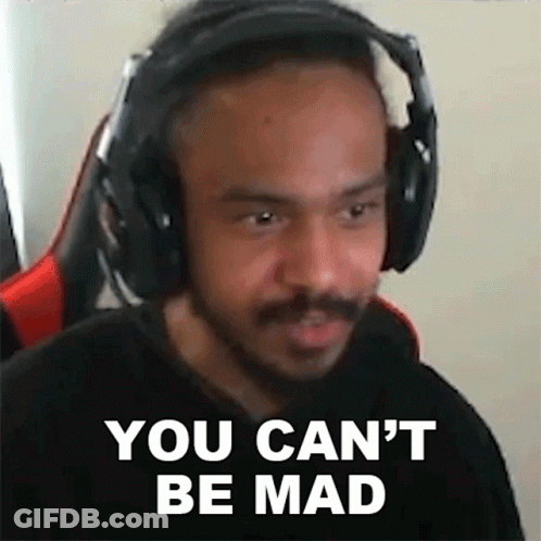 A Man Wearing Headphones Is Making A Funny Face . GIF