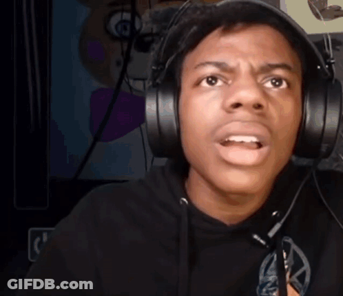 A Man Wearing Headphones Is Making A Funny Face While Looking At The Camera . GIF