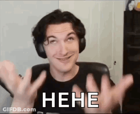 A Man Wearing Headphones Is Making A Funny Face While Sitting In A Chair With His Hands Up . GIF
