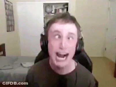 A Man Wearing Headphones Is Making A Funny Face While Sitting In A Gaming Chair . GIF