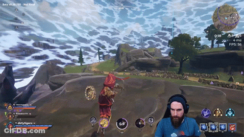 A Man Wearing Headphones Is Playing A Video Game With A Beta Version Visible GIF