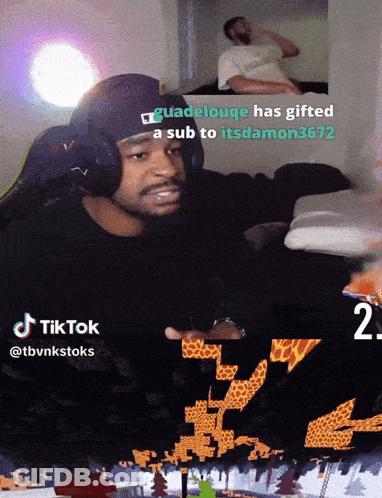 A Man Wearing Headphones Is Playing A Video Game With A Caption That Says Guadeloupe Has Gifted A Sub GIF