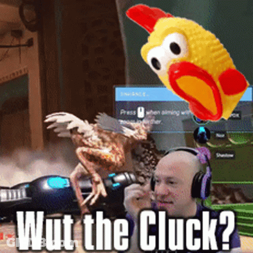 A Man Wearing Headphones Is Playing A Video Game With A Toy Chicken And The Words Wut The Cluck Below Him GIF