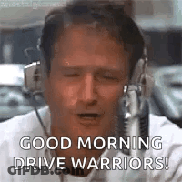 A Man Wearing Headphones Is Saying `` Good Morning Drive Warriors '' . GIF