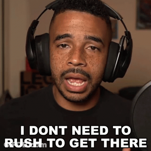 A Man Wearing Headphones Is Saying " I Don T Need To Rush To Get There " GIF