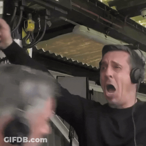 A Man Wearing Headphones Is Screaming With His Mouth Wide Open GIF