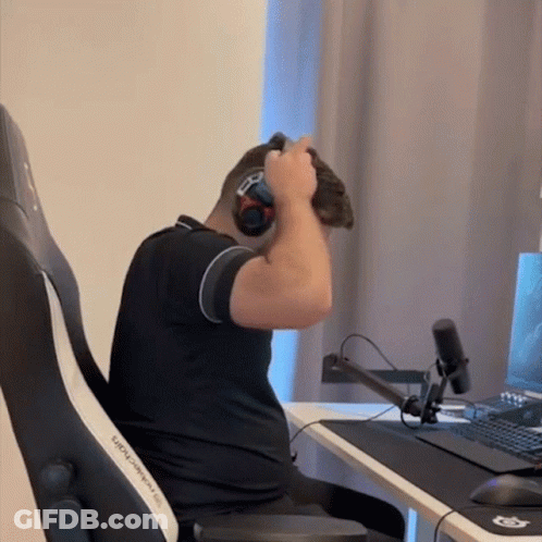 A Man Wearing Headphones Is Sitting In A Black And White Chair GIF