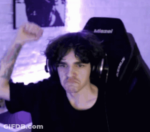 A Man Wearing Headphones Is Sitting In A Chair That Says Miravel GIF