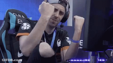 A Man Wearing Headphones Is Sitting In A Chair With The Number 26 On The Back GIF