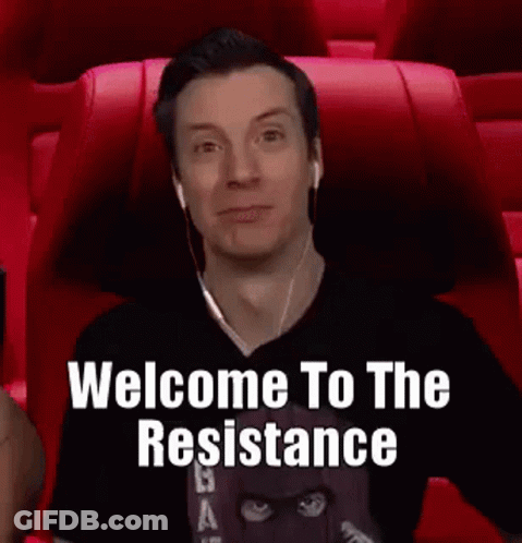 A Man Wearing Headphones Is Sitting In A Red Chair With The Words `` Welcome To The Resistance '' Written On The Screen GIF