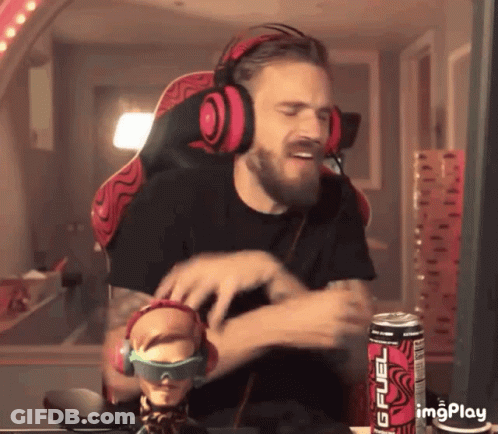 A Man Wearing Headphones Is Sitting In Front Of A Can Of Gfuel Energy Drink GIF