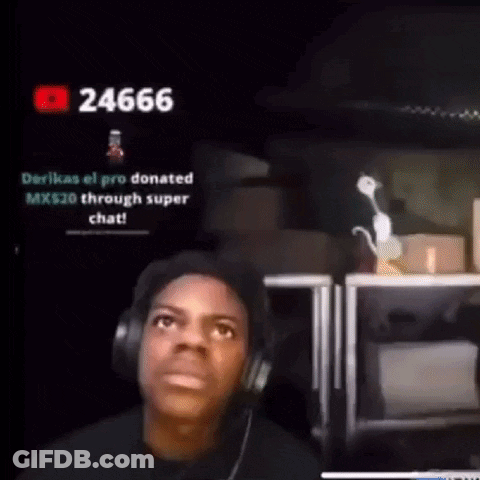 A Man Wearing Headphones Is Sitting In Front Of A Computer Monitor . GIF
