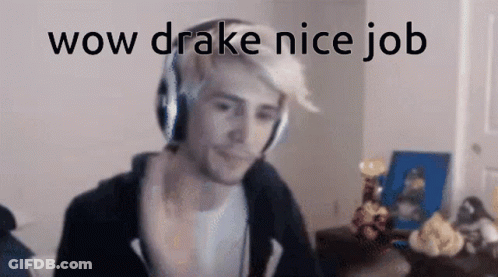 A Man Wearing Headphones Is Sitting In Front Of A Computer Screen And Says Wow Drake Nice Job . GIF