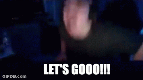 A Man Wearing Headphones Is Sitting In Front Of A Computer Screen With The Words `` Let 'S Goooo ! '' GIF