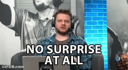 A Man Wearing Headphones Is Sitting In Front Of A Laptop Computer And Says No Surprise At All . GIF