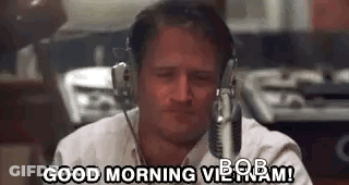 A Man Wearing Headphones Is Sitting In Front Of A Microphone And Says `` Good Morning Bob ! '' GIF