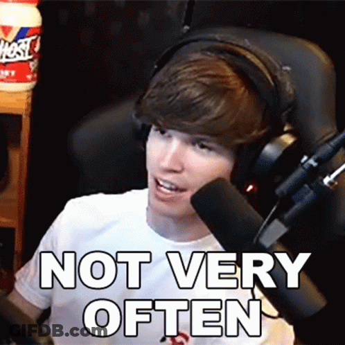 A Man Wearing Headphones Is Sitting In Front Of A Microphone And Says " Not Very Often " GIF