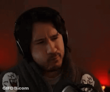 A Man Wearing Headphones Is Sitting In Front Of A Microphone And The Word Pass Is Above Him . GIF
