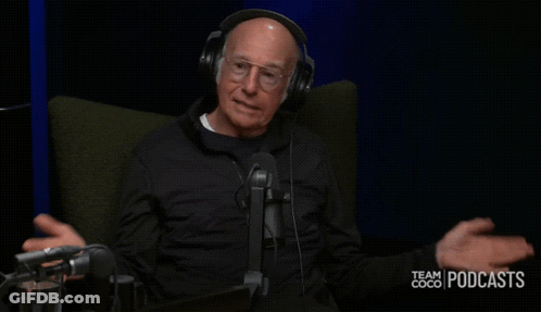 A Man Wearing Headphones Is Sitting In Front Of A Microphone With The Words Did Not Go Over Well Behind Him GIF