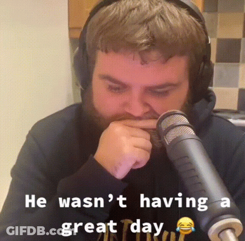 Man With Headphones Sitting In Front Of Microphone GIF