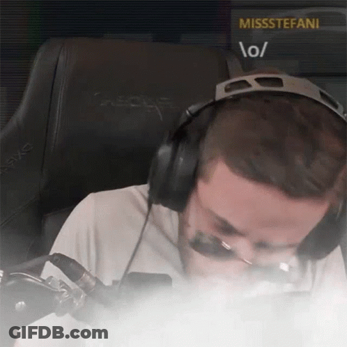 A Man Wearing Headphones Is Sitting In Front Of A Screen That Says Missstefani GIF