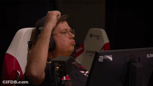 A Man Wearing Headphones Is Sitting In Front Of A Xl 256 Monitor GIF