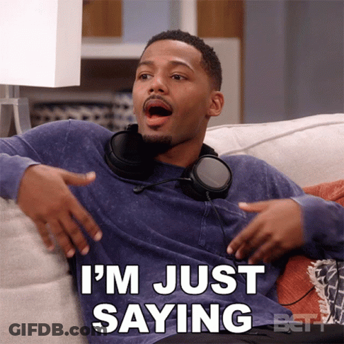 A Man Wearing Headphones Is Sitting On A Couch And Says " I 'M Just Saying " GIF
