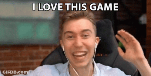 A Man Wearing Headphones Is Smiling And Saying I Love This Game . GIF
