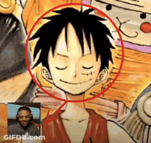A Man Wearing Headphones Is Smiling In Front Of A Drawing Of Monkey D Luffy GIF