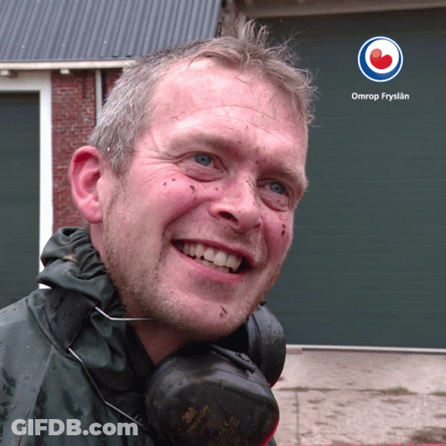 A Man Wearing Headphones Is Smiling In Front Of A Omrop Fryslan Logo GIF
