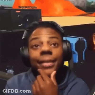 A Man Wearing Headphones Is Smiling In Front Of A Sign That Says Captain Morgan GIF