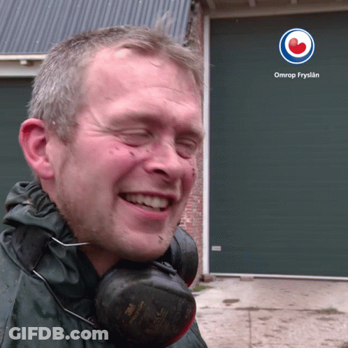 A Man Wearing Headphones Is Smiling In Front Of An Omrop Fryslan Logo GIF