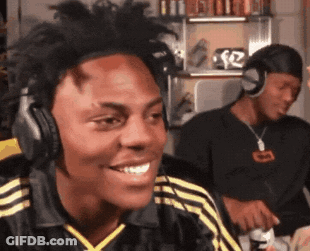 A Man Wearing Headphones Is Smiling While Another Man Looks On GIF