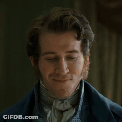 A Man Wearing Headphones Is Smiling With The Words " Eddy Eliminated Ishows " In The Background GIF