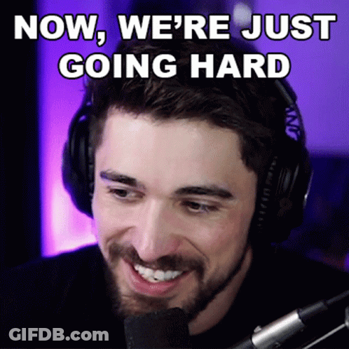 A Man Wearing Headphones Is Smiling With The Words Now We 'Re Just Going Hard Above Him GIF