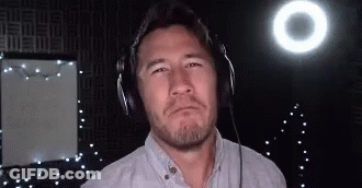 Man With Headphones Standing In Front Of Light GIF