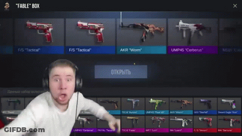 A Man Wearing Headphones Is Standing In Front Of A Rifle That Says Ump45 Cerberus Epic GIF