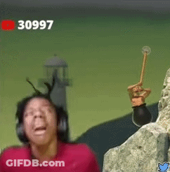 A Man Wearing Headphones Is Standing Next To A Rock And Holding A Hammer . GIF