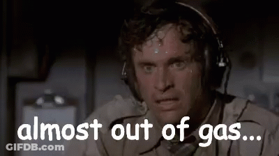 A Man Wearing Headphones Is Sweating And Saying `` Almost Out Of Gas ... '' GIF