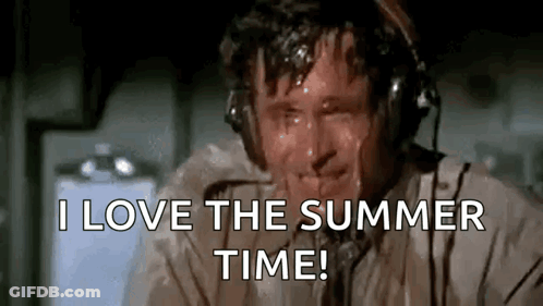 A Man Wearing Headphones Is Sweating And Saying I Love The Summer Time . GIF