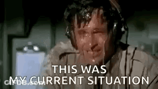 A Man Wearing Headphones Is Sweating While Talking On A Cell Phone . GIF