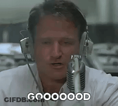 A Man Wearing Headphones Is Talking Into A Microphone And Saying `` Goooood '' . GIF