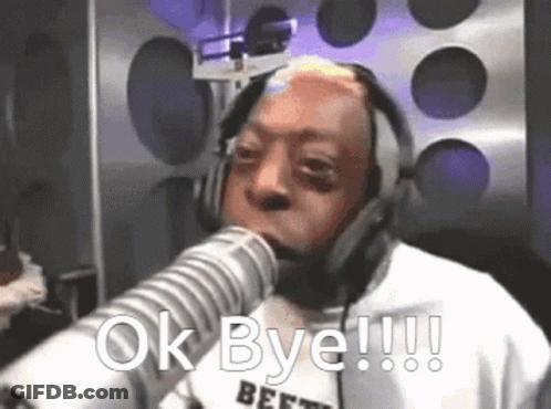 A Man Wearing Headphones Is Talking Into A Microphone And Says Ok Bye GIF