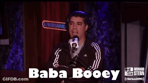 A Man Wearing Headphones Is Talking Into A Microphone With The Words Baba Booey Above Him GIF