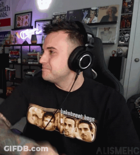 A Man Wearing Headphones Is Wearing A Shirt That Says Boys GIF