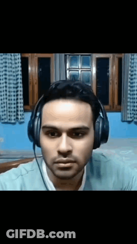 Man With Headphones Looking At Camera GIF