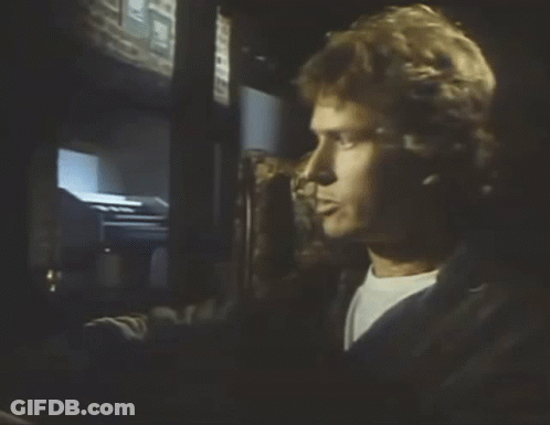 A Man Wearing Headphones Looks At A Screen That Says ' I 'M Sorry ' On It GIF