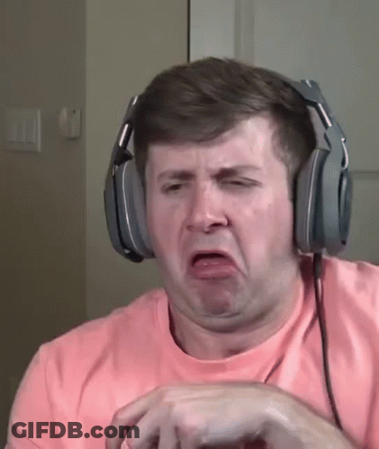 A Man Wearing Headphones Making A Funny Face . GIF