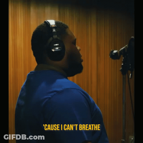 A Man Wearing Headphones Says ' Cause I Can 'T Breathe ' In Yellow Letters GIF